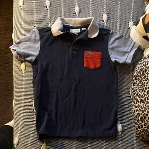 Lacoste Navy Polo with Light Gray Sleeves and Red Pocket